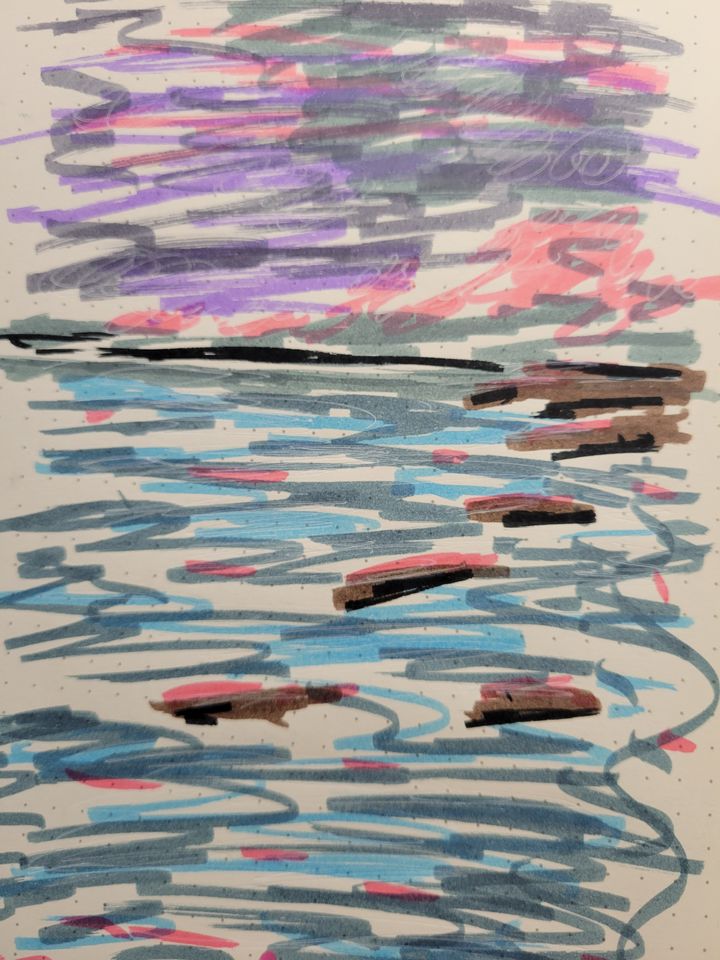 Marker picture of a scribbled ocean landscape with rocks on dot grid paper.